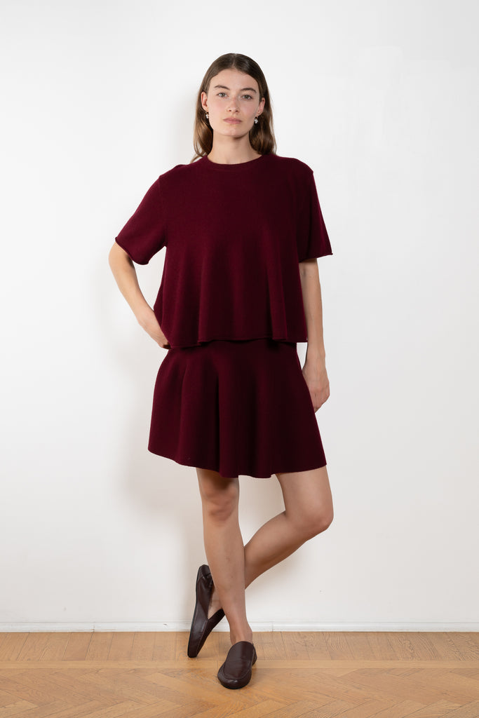 The Liru Tshirt by LISA YANG is knitted in 12-gauge cashmere. The relaxed fit falls from a ribbed round neck into a wide A-line, peplum-inspired shape, complete with dropped shoulders, short sleeves and rolled hems