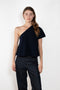The Livana Top by LISA YANG reimagines everyday knitwear with a modern, asymmetrical silhouette.
