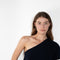 The Livana Top by LISA YANG reimagines everyday knitwear with a modern, asymmetrical silhouette.