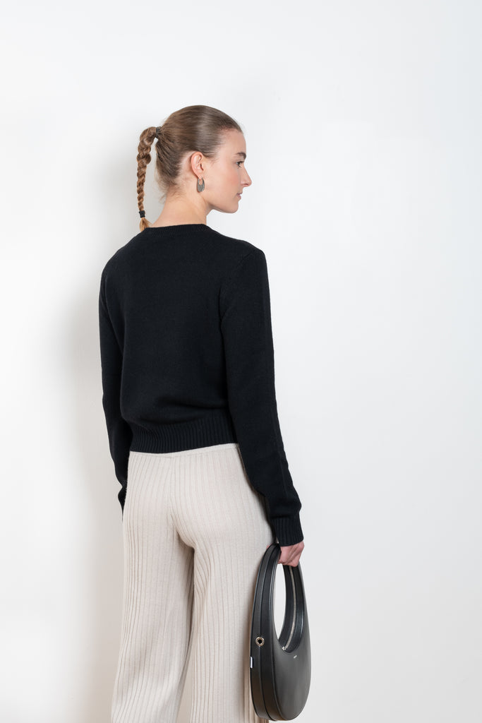 The Mable Sweater by Lisa Yang is a signature fitted cashmere sweater with ribbed trims, a comfortable round neck and long sleeves