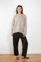 The Noor Sweater by Lisa Yang features a ribbed neck, dropped shoulders, oversized profile.