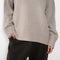 The Noor Sweater by Lisa Yang features a ribbed neck, dropped shoulders, oversized profile.
