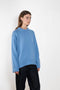 The Noor Sweater by Lisa Yang features a ribbed neck, dropped shoulders, oversized profile.
