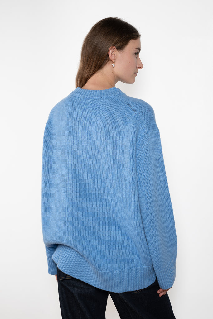 The Noor Sweater by Lisa Yang features a ribbed neck, dropped shoulders, oversized profile.