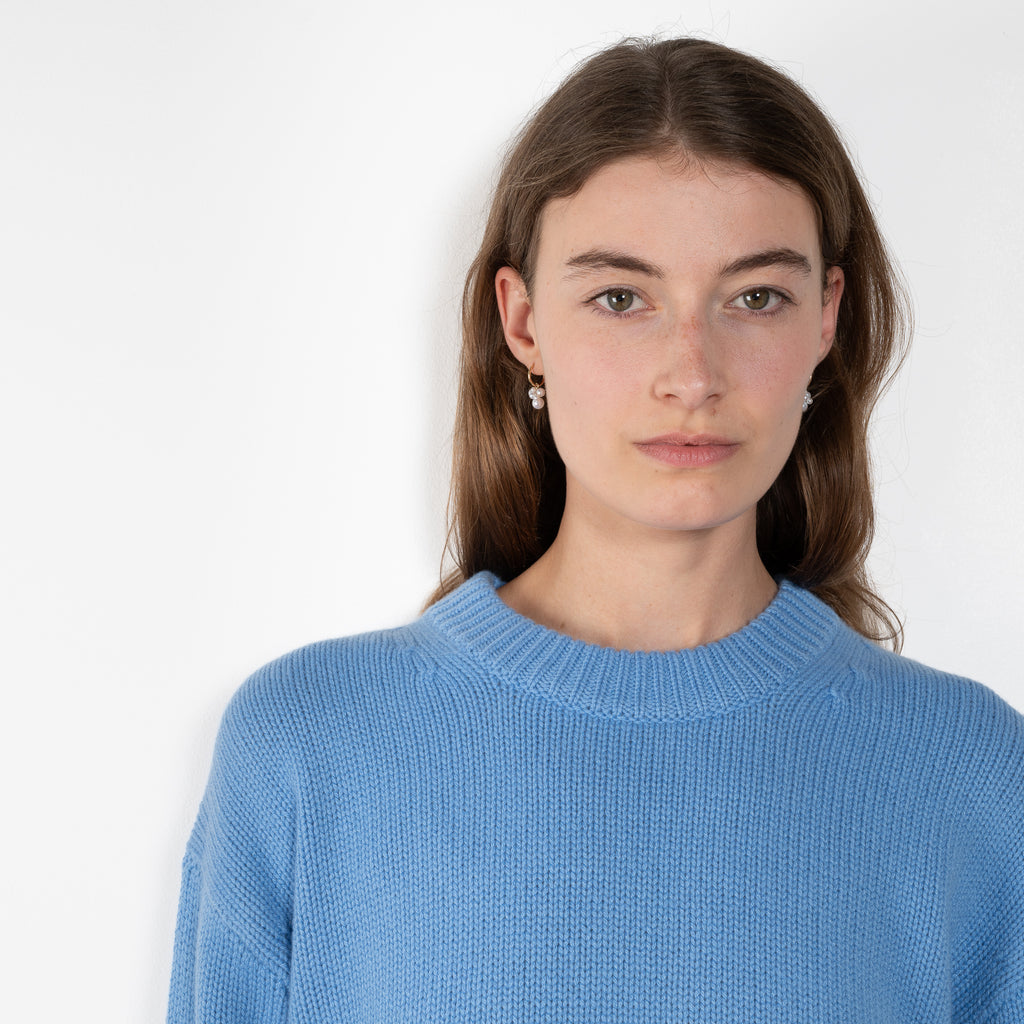 The Noor Sweater by Lisa Yang features a ribbed neck, dropped shoulders, oversized profile.