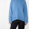 The Noor Sweater by Lisa Yang features a ribbed neck, dropped shoulders, oversized profile.
