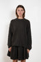 The Seymour Sweater by Lisa Yang with its soft cashmere quality, which moulds comfortably to your skin.