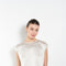 The Round Neck Sleeveless Top by LISA YANG in a woven satin silk, has a neat rounded neckline and relaxed fit silhouette
