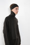 The Zerlina Sweater by Lisa Yang is a timeless cashmere turtleneck with a relaxed, effortless silhouette