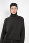 The Zuula Headband by Lisa Yang is a minimalist cashmere headband with a clean, plain-knit design