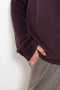 The Sandy Sweater by LISA YANG has a straight fit with dropped shoulders and a raw hem mock neck