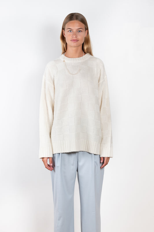 The Aranos Sweater by Loulou Studio is a relaxed sweater with a loose fit and check pattern in a soft cashmere