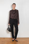 The Azae Blouse by Loulou Studio is a refined silk twill blouse with a draped detail and hardware embellishment