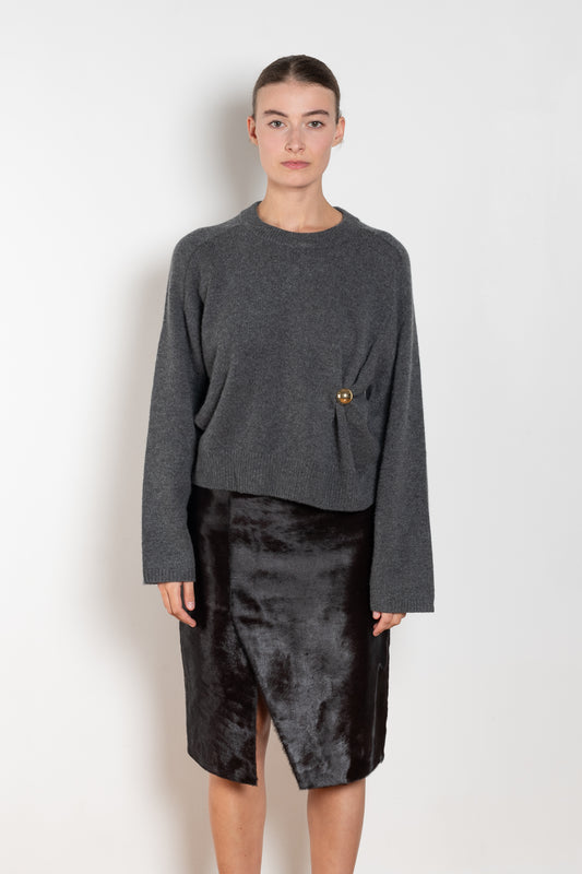 The Bill Sweater by Loulou Studio is thick soft cashmere sweater with a draped detail and an hardware embellishment