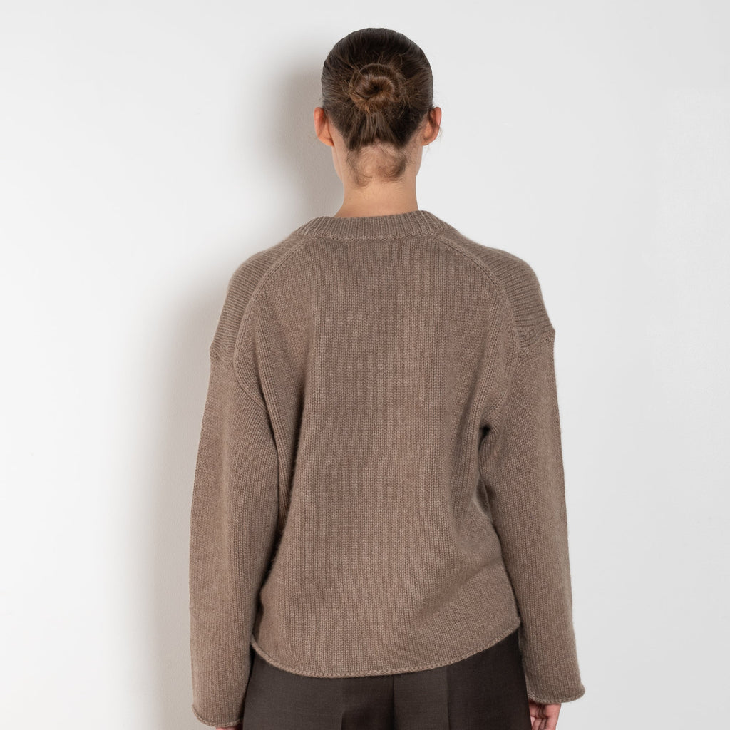The Derry Sweater by Loulou Studio is an relaxed sweater with an ample fit, a deep U, dropped shoulders and ribbed details in a thicker cashmere