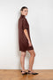 The Elton Mini Dress by Loulou Studio is a mini dress with a high standing collar and two side pockets
