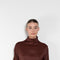 The Elton Mini Dress by Loulou Studio is a mini dress with a high standing collar and two side pockets