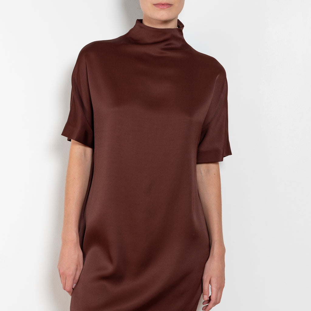 The Elton Mini Dress by Loulou Studio is a mini dress with a high standing collar and two side pockets