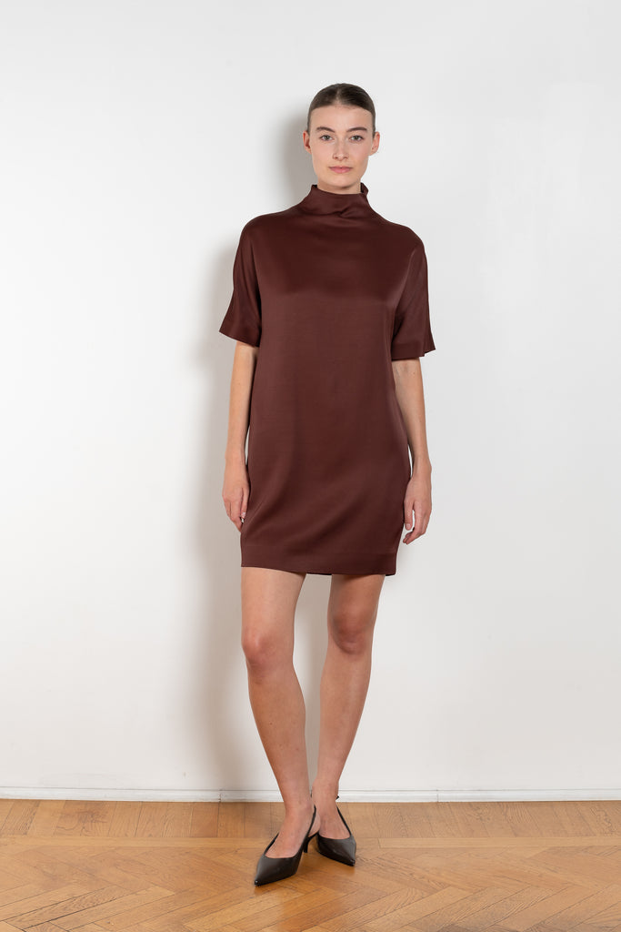 The Elton Mini Dress by Loulou Studio is a mini dress with a high standing collar and two side pockets