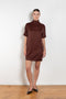 The Elton Mini Dress by Loulou Studio is a mini dress with a high standing collar and two side pockets