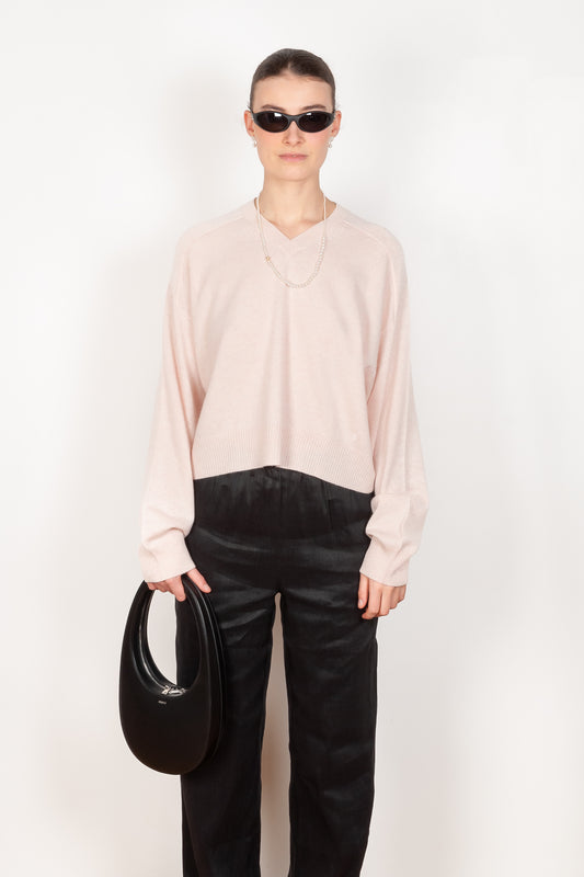 The Emsalo V-Neck Sweater by Loulou Studio is a v-neck pullover with feminine sleeves in a soft cashmere