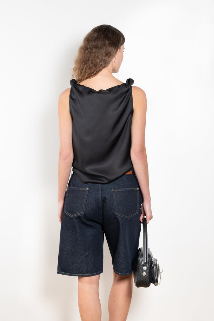 The Isu Short by Loulou Studio is a mid rise jeans short with bermuda-like proportions