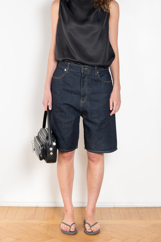 The Isu Short by Loulou Studio is a mid rise jeans short with bermuda-like proportions