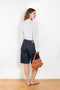 The Isu Short by Loulou Studio is a mid rise jeans short with bermuda-like proportions