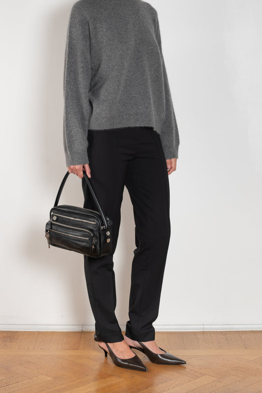 The Malka Trouser by Loulou Studio is a slightly fitted trouser with a low waistband