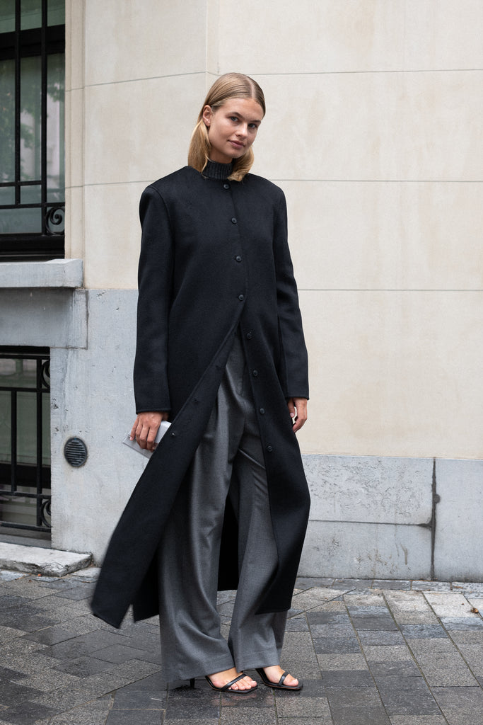 The Martil Coat by Loulou Studio is a straight long buttoned coat with minimal lines and a round neck