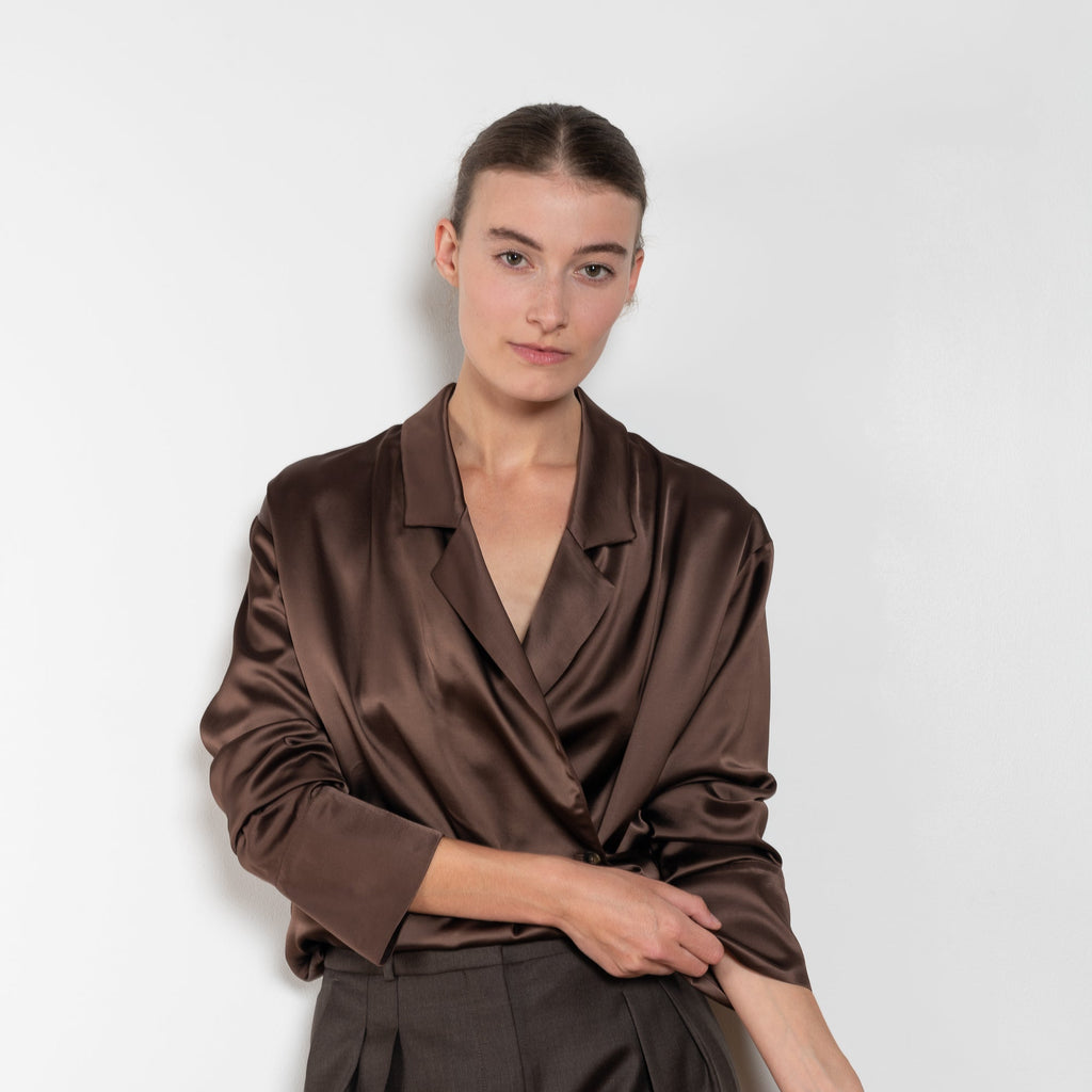 The Persia Top by Loulou Studio is an elegant top with shirting inspired details in a viscose and wool satin