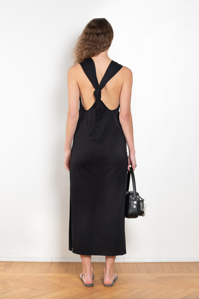 The Rayna Dress by Loulou Studio is a cotton jersey maxi dress with a cross knot detail on the back