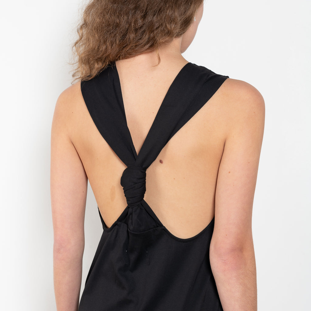 The Rayna Dress by Loulou Studio is a cotton jersey maxi dress with a cross knot detail on the back