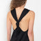 The Rayna Dress by Loulou Studio is a cotton jersey maxi dress with a cross knot detail on the back