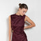 The Roan Dress by Loulou Studio is an elegant evening dress with a draped detail and hardware embellishment in a fluid silk twill