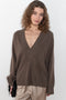 The Sage Sweater by Loulou Studio is an oversized sweater with an ample fit, a deep V, dropped shoulders