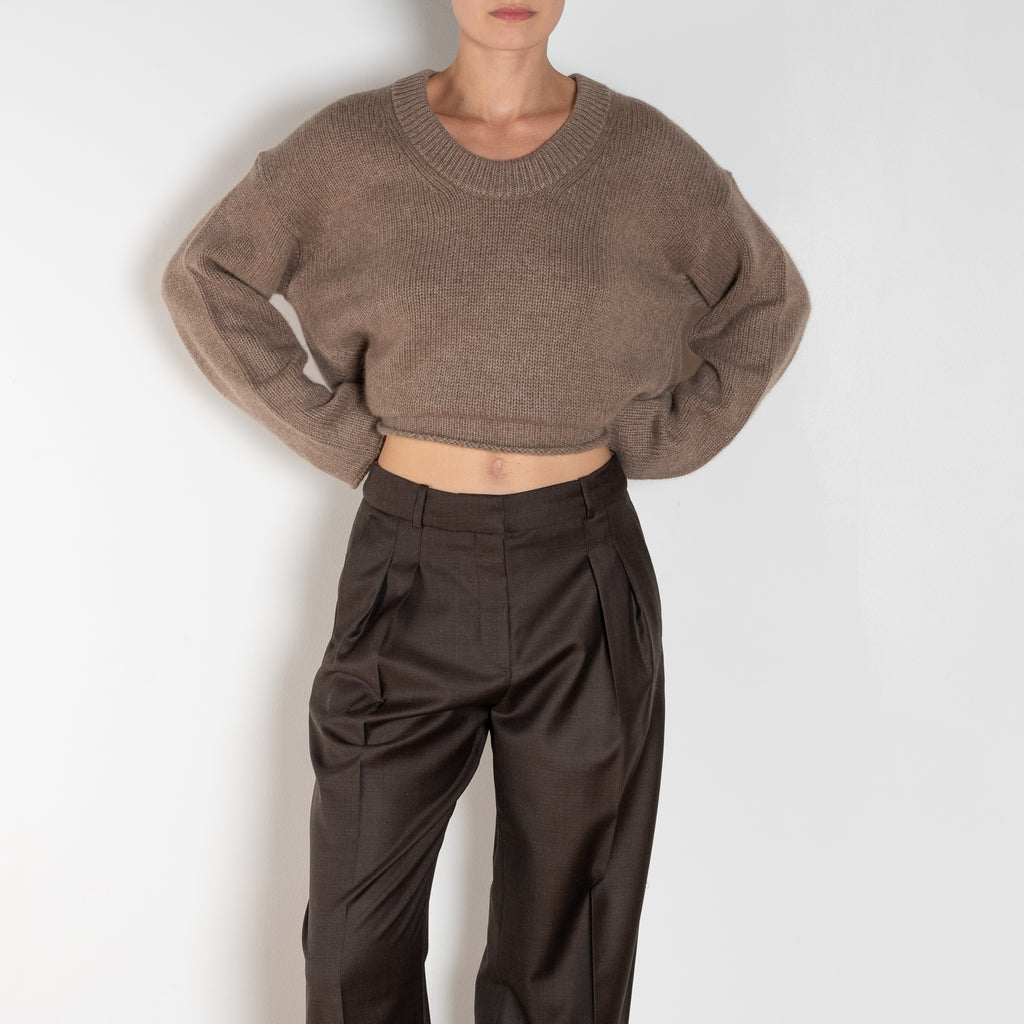 The Sbiru Pants by Loulou Studio are signature suiting paints that sit on the waist, are ample and pleated at the waist