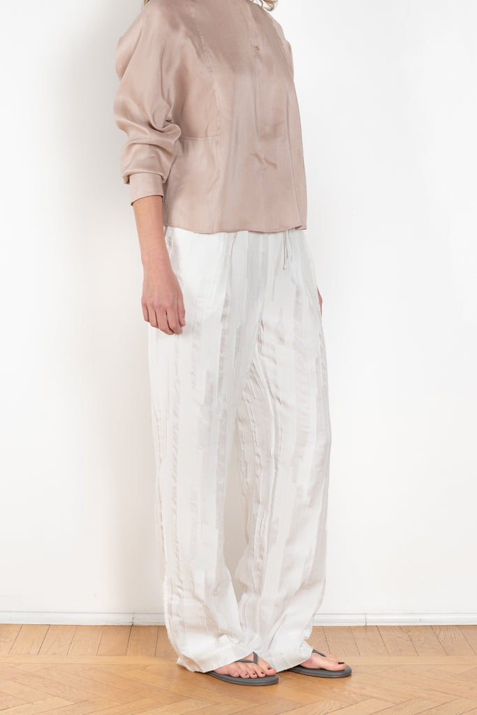 The Soler Trouser by Loulou Studio are textured brushed trousers made of a silk cotton blend with a straight relaxed fit