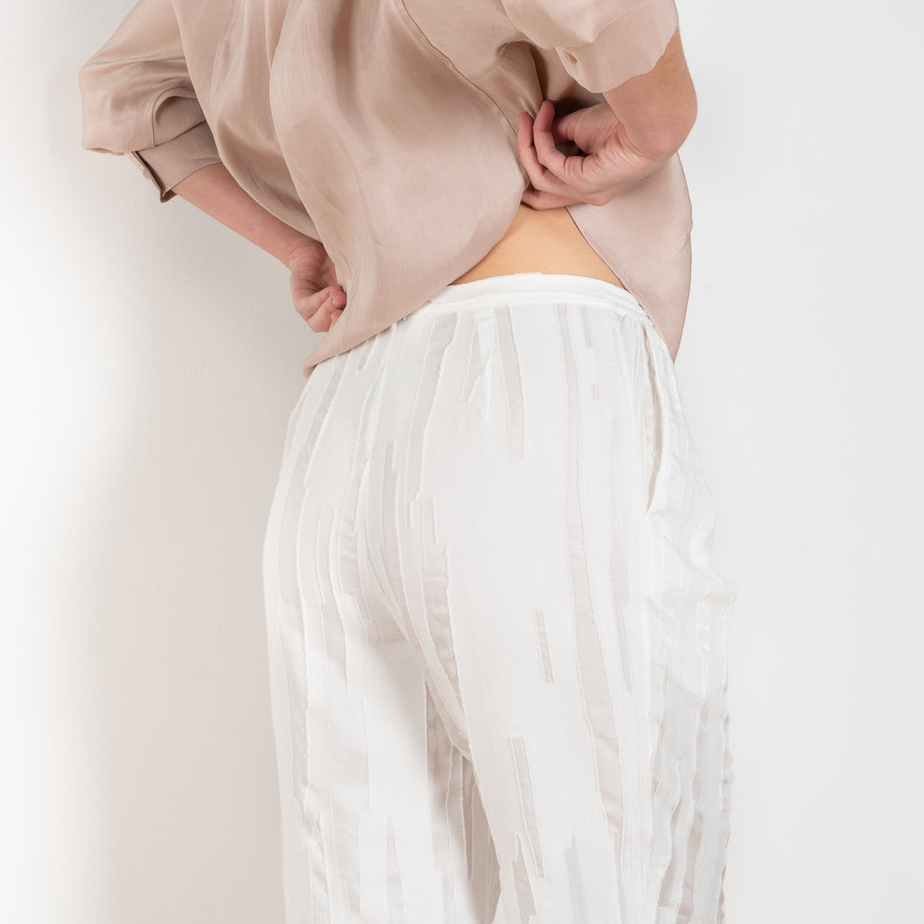 The Soler Trouser by Loulou Studio are textured brushed trousers made of a silk cotton blend with a straight relaxed fit