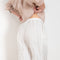The Soler Trouser by Loulou Studio are textured brushed trousers made of a silk cotton blend with a straight relaxed fit