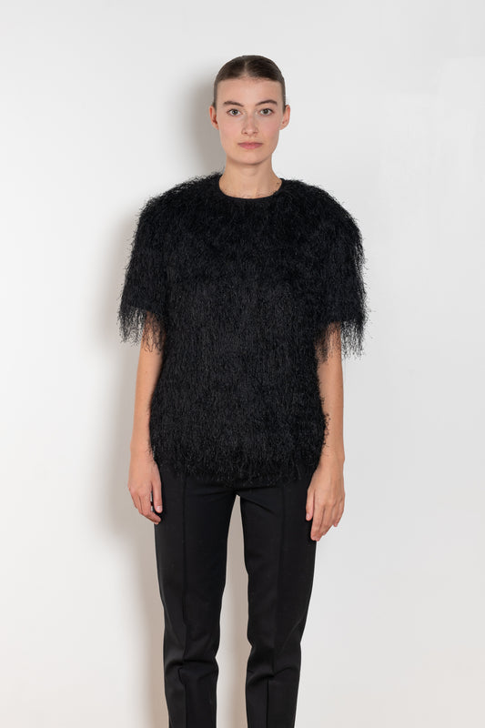 The Zaro Top by Loulou Studio is a short sleeve top with a round neck and long fringes