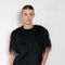 The Zaro Top by Loulou Studio is a short sleeve top with a round neck and long fringes