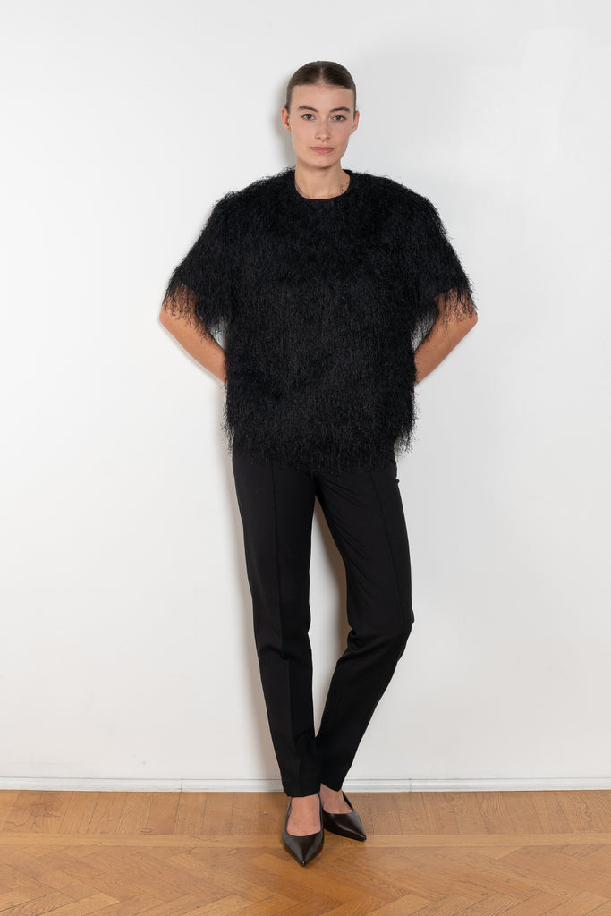 The Zaro Top by Loulou Studio is a short sleeve top with a round neck and long fringes