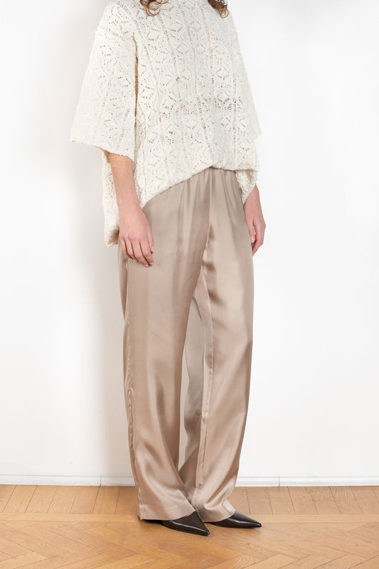The Alera Trouser by Loulou Studio is a trouser with a relaxed fit in a fluid and lightweight summer silk