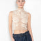 The Crochet Lace Top by Magda Butrym is a cropped top with a high neck and an all-over floral design in traditional Polish crochet technique