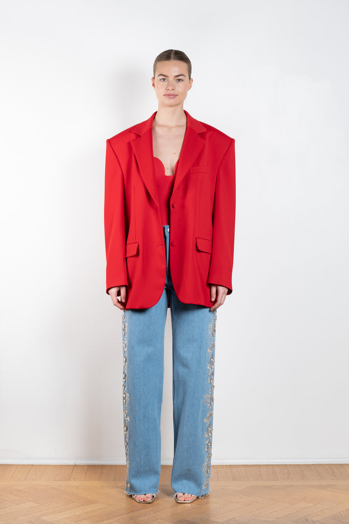 The Crystal Flower Embroidered Denim 12 by Magda Butrym is a relaxed wide leg light blue denim with sequin and gem embroidered detailing down the legs, featuring flower details