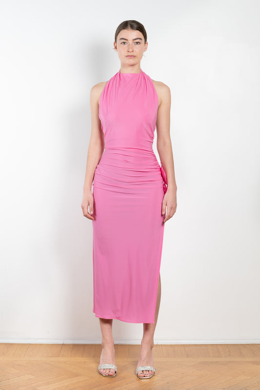 The Halter Jersey Dress 14 by Magda Butrym is a long halter dress in a soft jersey with a cinched waist that gathers at the side with 3D flower details