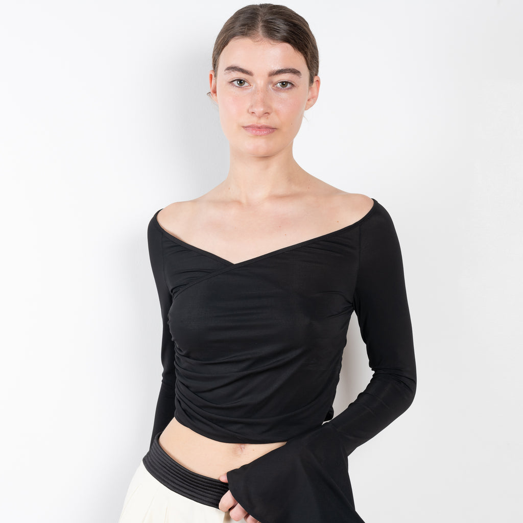 The Bell Sleeve Top 07 by Magda Butrym is an elegant black top with a v neck ballerina neckline and off the shoulder bell sleeves