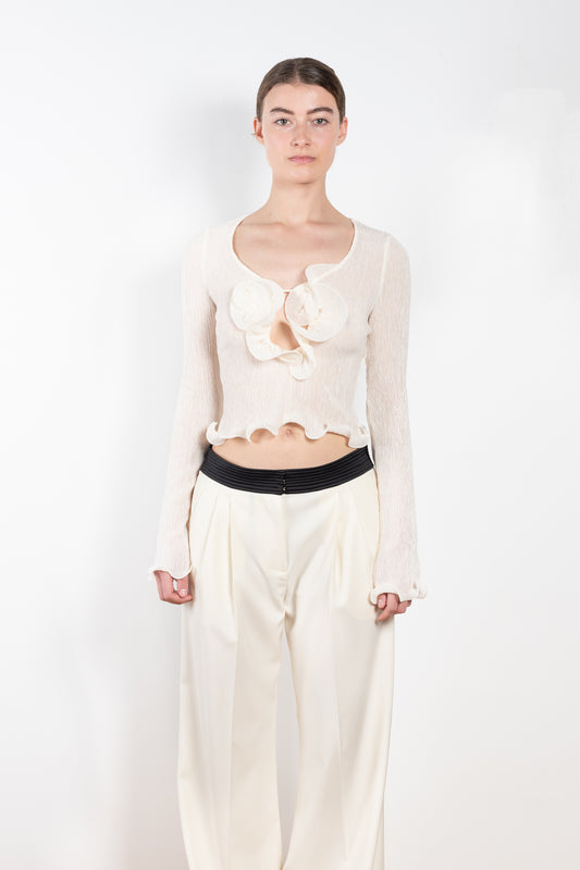 The Shirred Flower Top 02 by Magda Butrym is a cropped long sleeve top with a deep 3D flower decolte and ruffled finish
