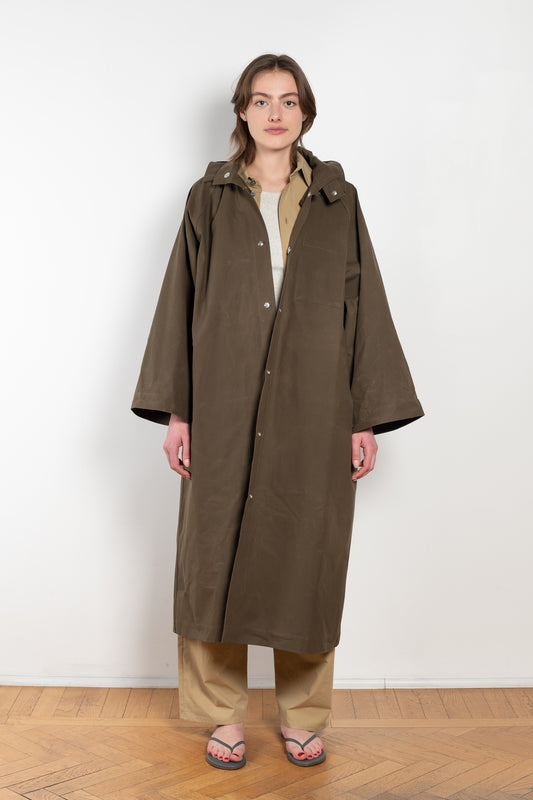The Parka Coat Oil by Maud Van Den Beussche is a long parka in a structured cotton with detachable hood